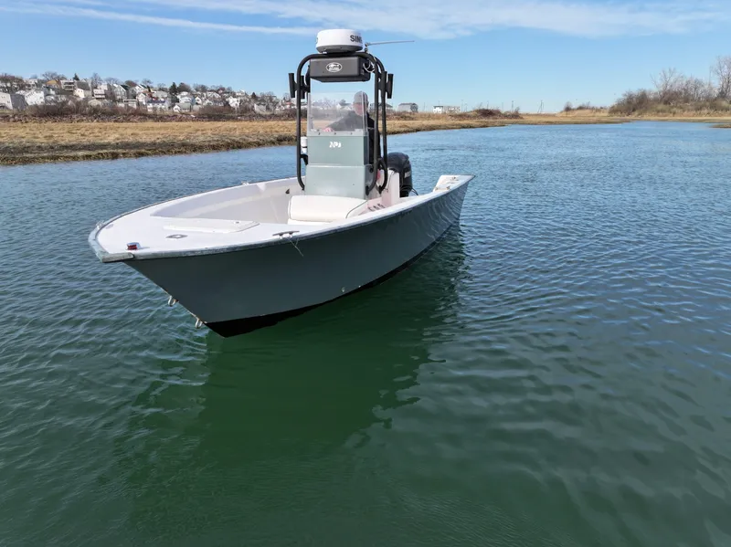 Slide: The Image of 2003 Key Largo 216cc boat on calm water, clear sky background. - 5
