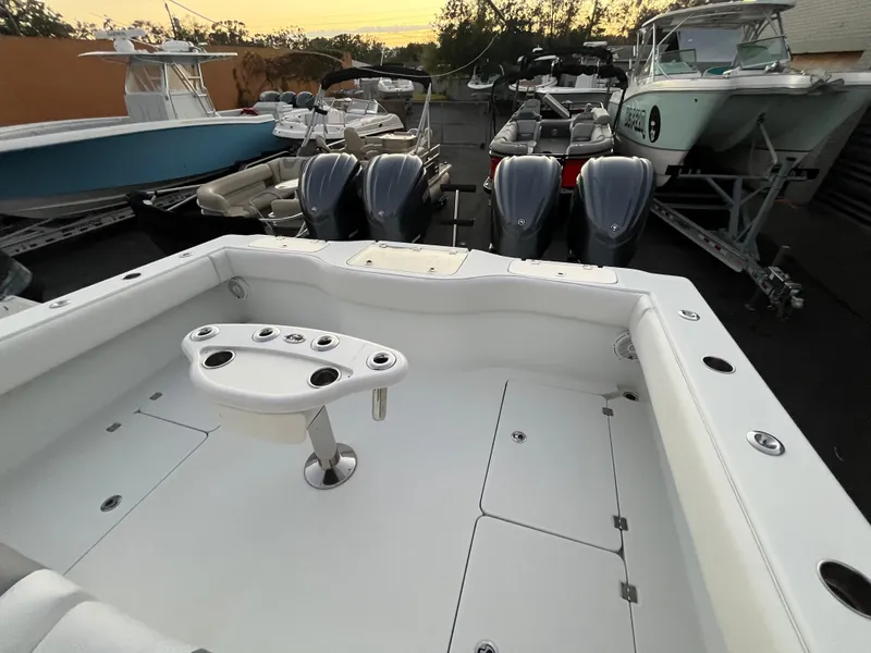 Slide: The Image of 2017 Freeman 37 VH boat deck with multiple outboard engines in a marina setting. - 10