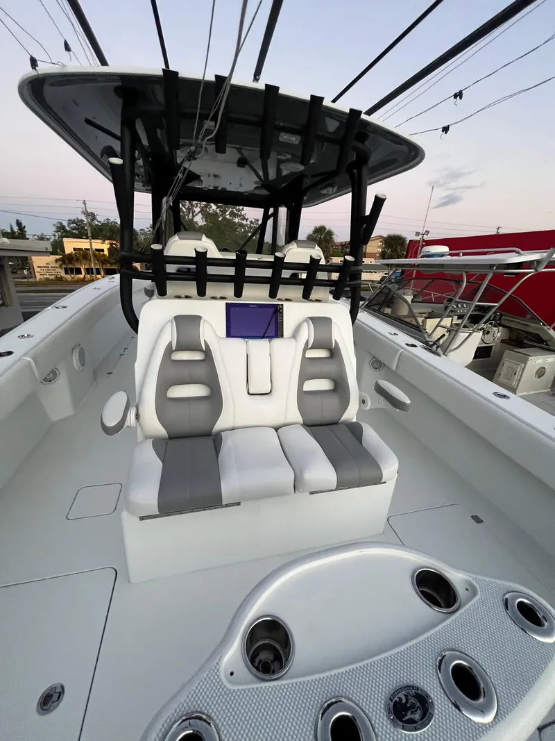 Slide: The Image of Freeman 37 VH 2017 boat interior with seating and console, featuring modern design elements. - 11