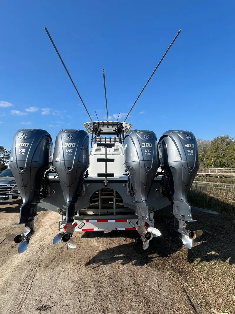Slide: The Image of 2017 Freeman 37 VH boat with four powerful outboard engines. - 13