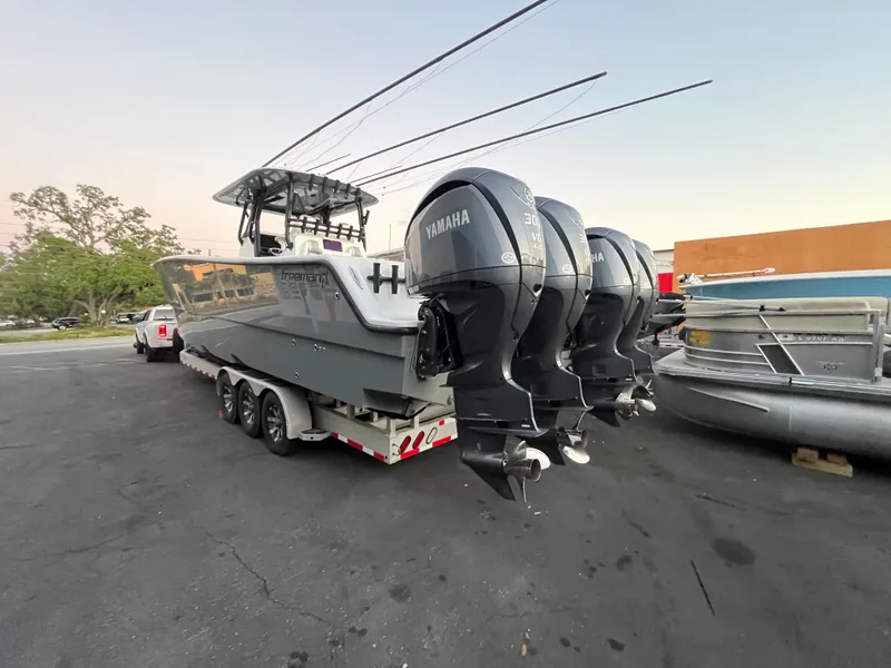 Slide: The Image of 2017 Freeman 37 VH boat with Yamaha outboard engines on a trailer. - 4