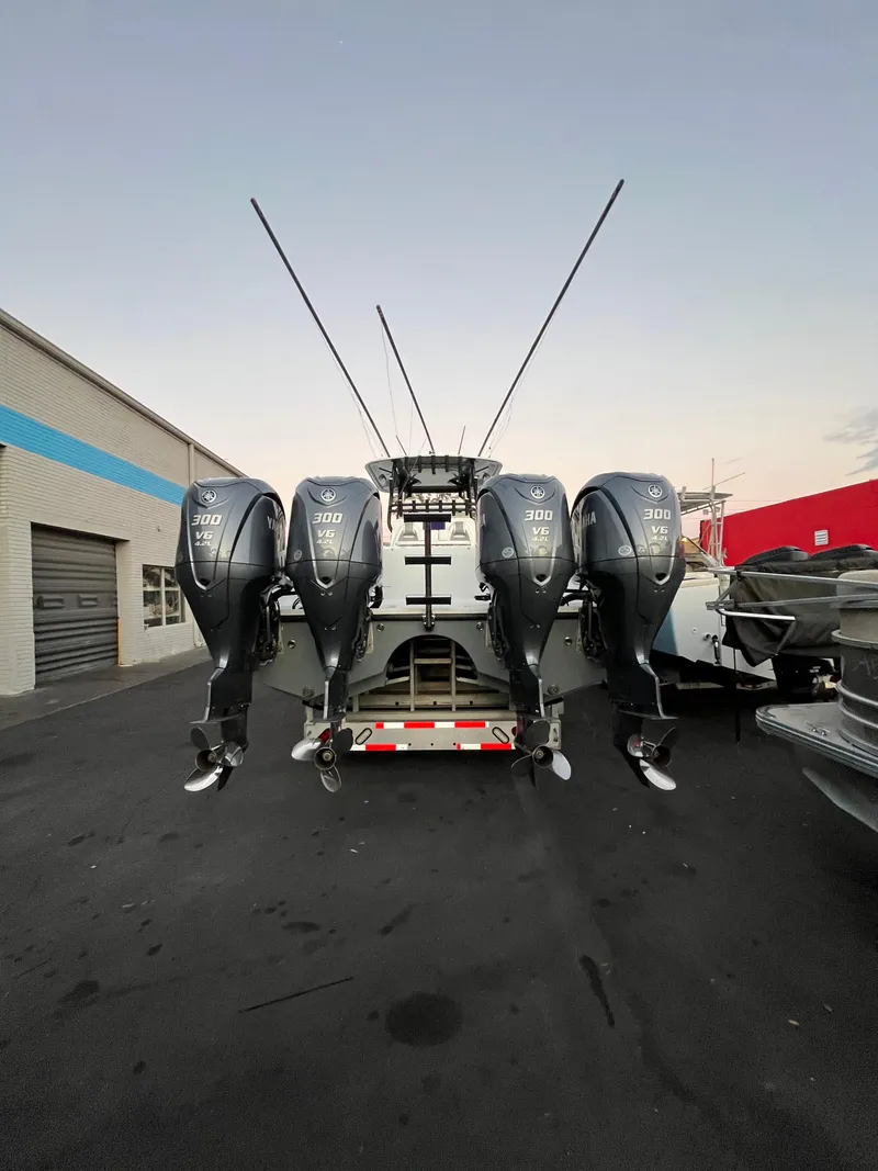 Slide: The Image of Freeman 37 VH 2017 boat with four powerful outboard engines in a parking lot. - 6