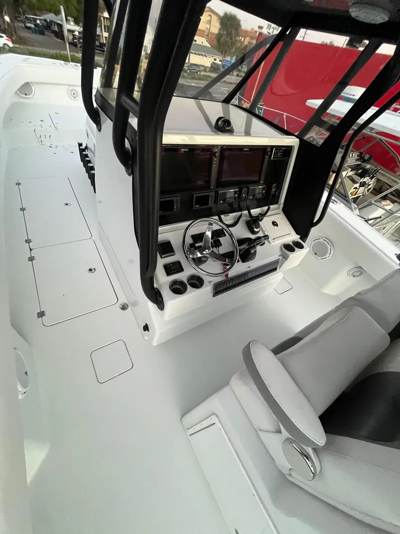 Slide: The Image of Freeman 37 VH 2017 boat cockpit with steering wheel and navigation controls. - 9
