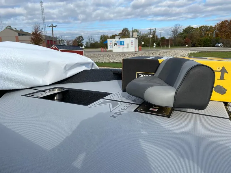 Slide: The Image of 2025 Xpress H20 Bass boat deck with seat and storage compartment. - 5