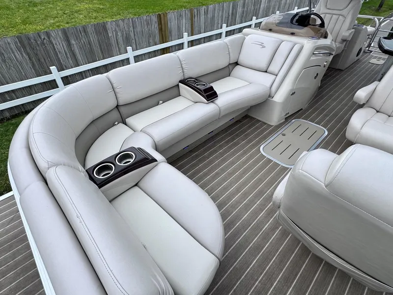 Slide: The Image of 2014 Bennington 2575 RCW pontoon boat with luxurious seating and cup holders. - 13