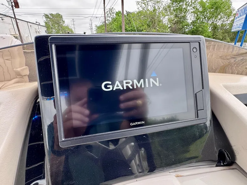 Slide: The Image of Garmin display on 2014 Bennington 2575 RCW boat dashboard, showing startup screen. - 14
