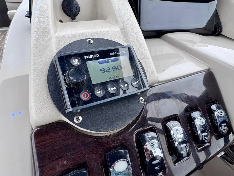 Slide: The Image of Close-up of a 2014 Bennington 2575 RCW boat dashboard with Fusion MS-RA205 stereo system. - 15