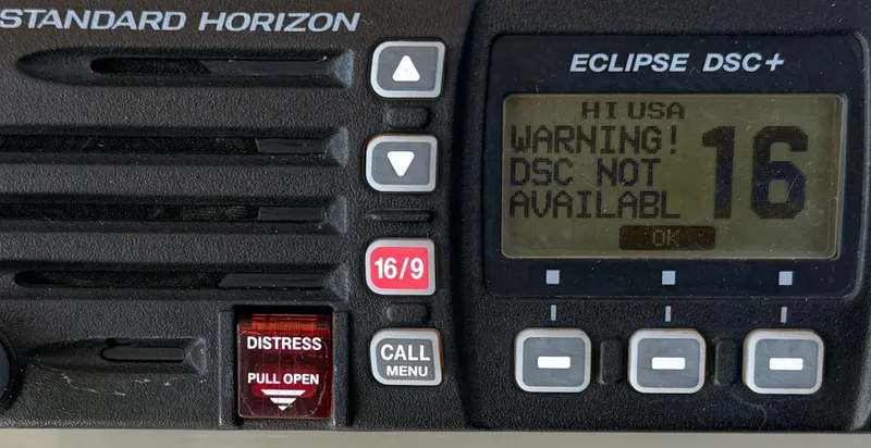 Slide: The Image of VHF radio display showing DSC warning on a 2008 Larson 310 Cabrio boat. - 20