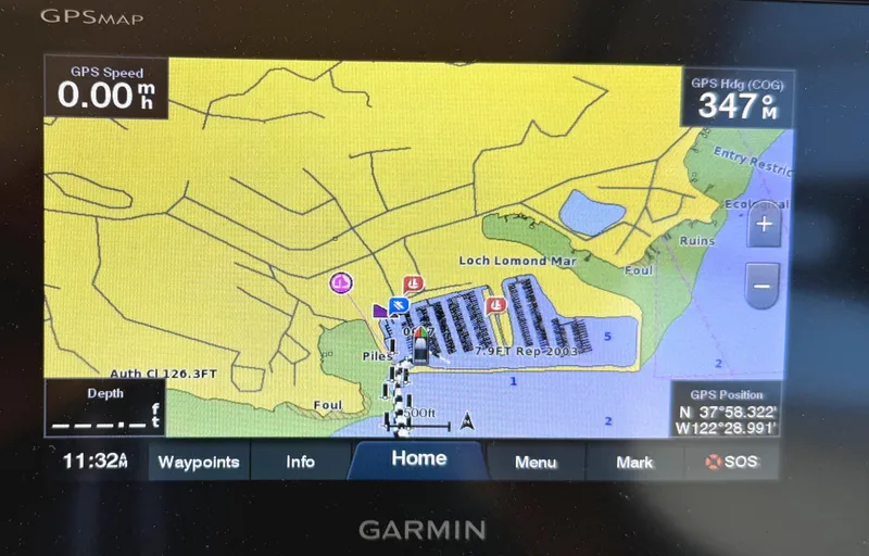 Slide: The Image of Garmin GPS display showing a nautical map, Larson 310 Cabrio, 2008 model. - 22