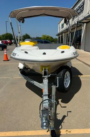 Slide: The Image of 2004 Sea-Doo Sportster LE DI boat on trailer, parked outdoors. - 3