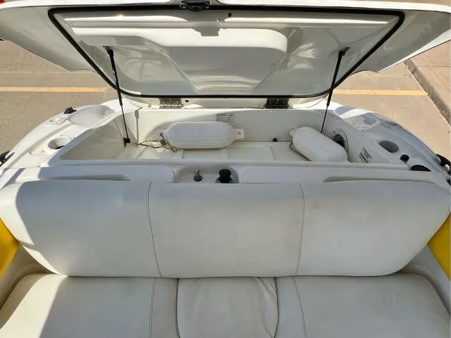 Slide: The Image of 2004 Sea-Doo Sportster LE DI boat interior with open storage compartment. - 7