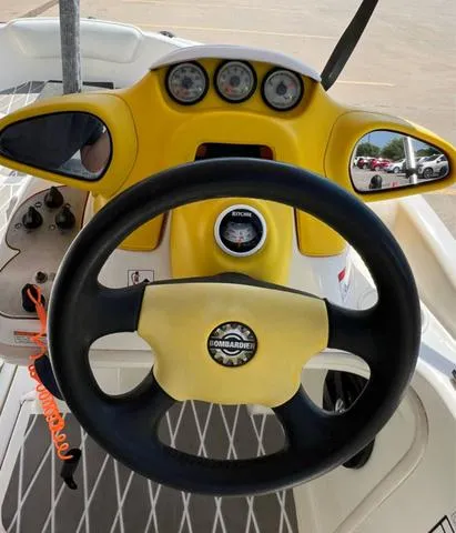 Slide: The Image of 2004 Sea-Doo Sportster LE DI dashboard with steering wheel and gauges. - 8