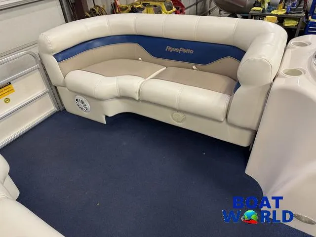 Slide: The Image of 2002 Godfrey 220 DF Pontoon interior seating with blue and beige upholstery. - 10