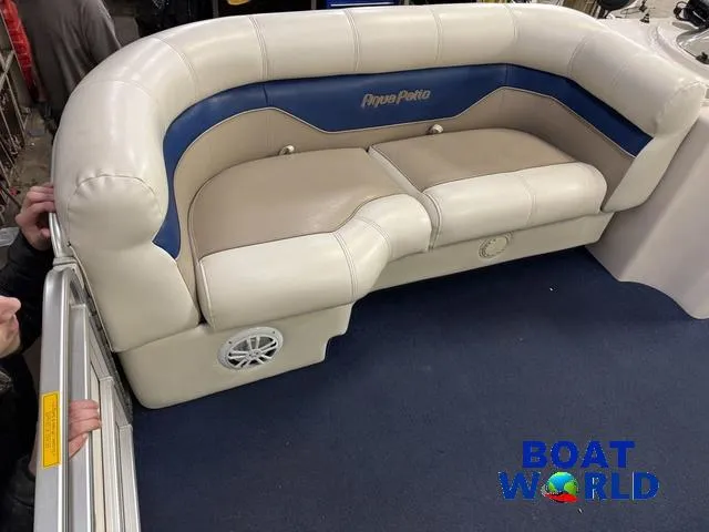Slide: The Image of 2002 Godfrey 220 DF Pontoon boat interior with beige and blue seating. - 11
