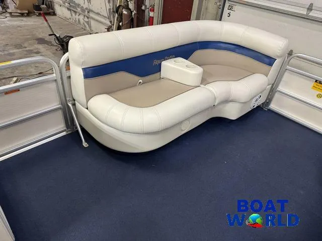 Slide: The Image of 2002 Godfrey 220 DF Pontoon boat interior with cushioned seating and blue accents. - 12