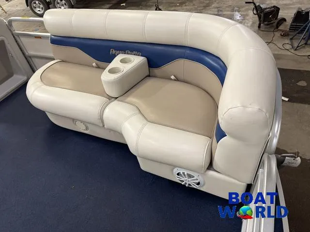 Slide: The Image of 2002 Godfrey 220 DF Pontoon boat seat with cup holders and blue accents. - 13