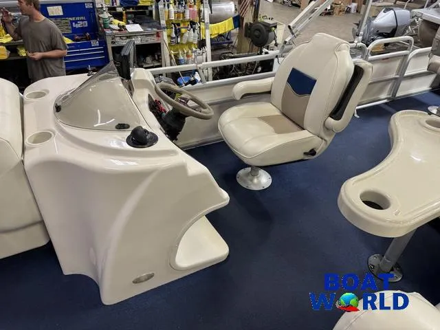 Slide: The Image of 2002 Godfrey 220 DF Pontoon boat interior with captain's chair and control console. - 15