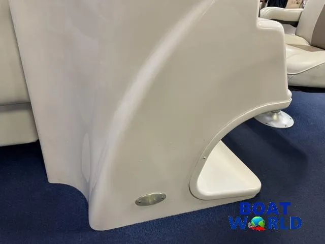 Slide: The Image of 2002 Godfrey 220 DF Pontoon interior detail with beige seating and blue carpet. - 16