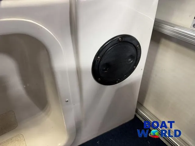 Slide: The Image of Interior of 2002 Godfrey 220 DF Pontoon boat with speaker detail. - 22