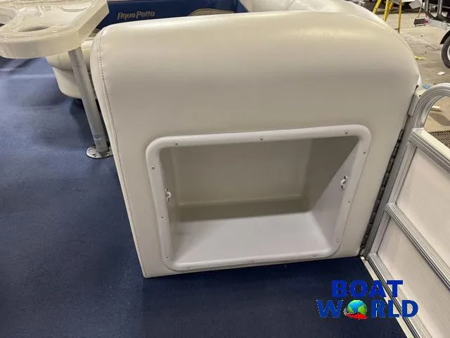 Slide: The Image of 2002 Godfrey 220 DF Pontoon seat storage compartment, blue carpet, Boat World logo. - 25