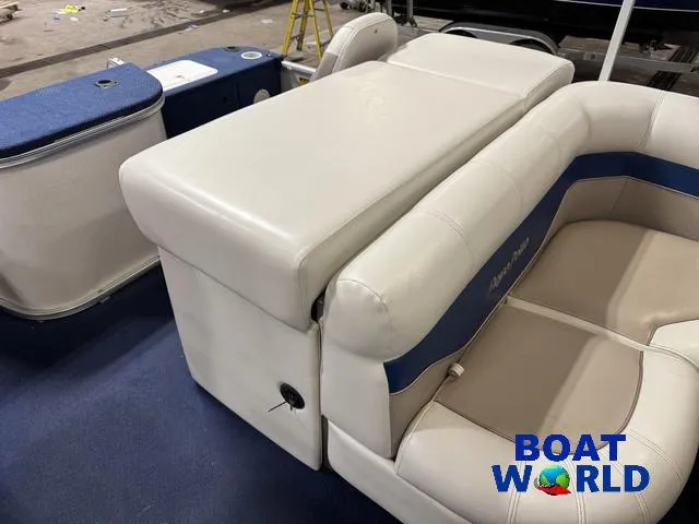 Slide: The Image of 2002 Godfrey 220 DF Pontoon boat interior with beige and blue seating, Boat World logo. - 31