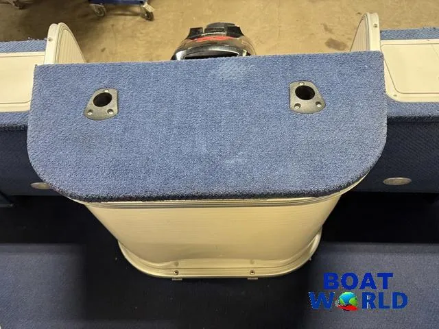 Slide: The Image of 2002 Godfrey 220 DF Pontoon boat interior with blue carpet and Boat World logo. - 39