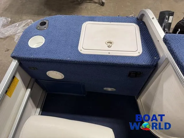 Slide: The Image of 2002 Godfrey 220 DF Pontoon boat interior with blue carpet and storage compartment. - 40