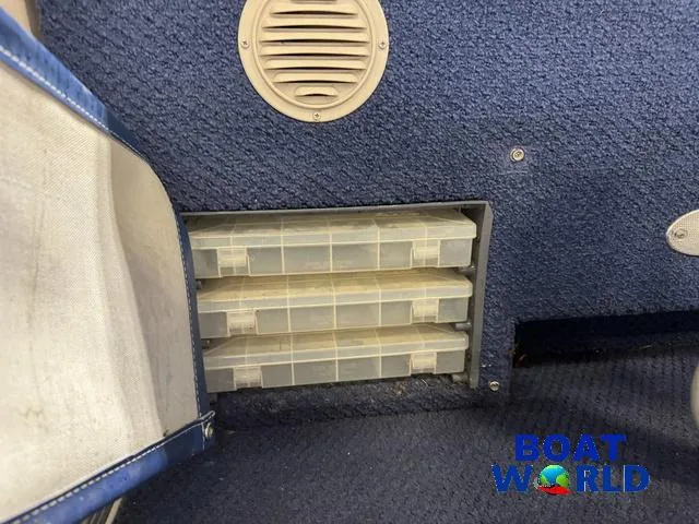 Slide: The Image of Storage compartment on 2002 Godfrey 220 DF Pontoon with tackle boxes and speaker. - 43