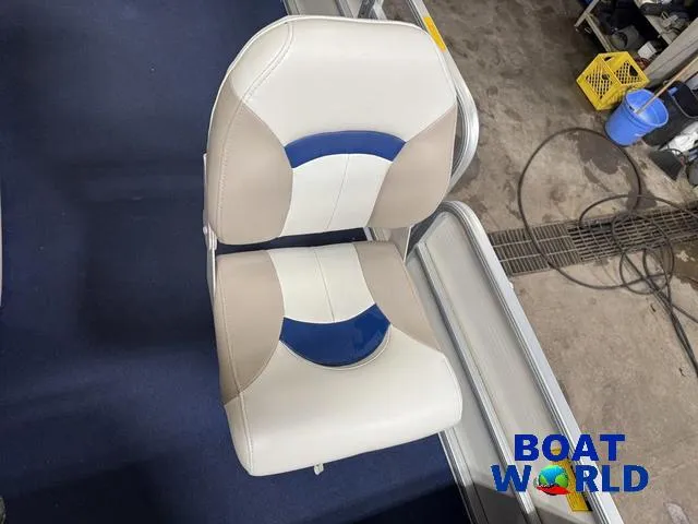 Slide: The Image of Godfrey 220 DF Pontoon 2002 boat seats with blue and beige design at Boat World showroom. - 44