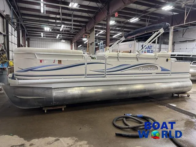 Slide: The Image of 2002 Godfrey 220 DF Pontoon boat in a warehouse setting. - 48