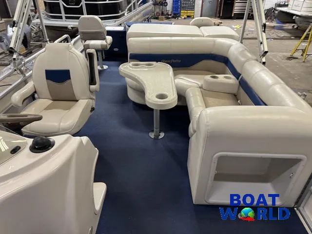 Slide: The Image of 2002 Godfrey 220 DF Pontoon interior with seating and table, showcased at Boat World. - 5