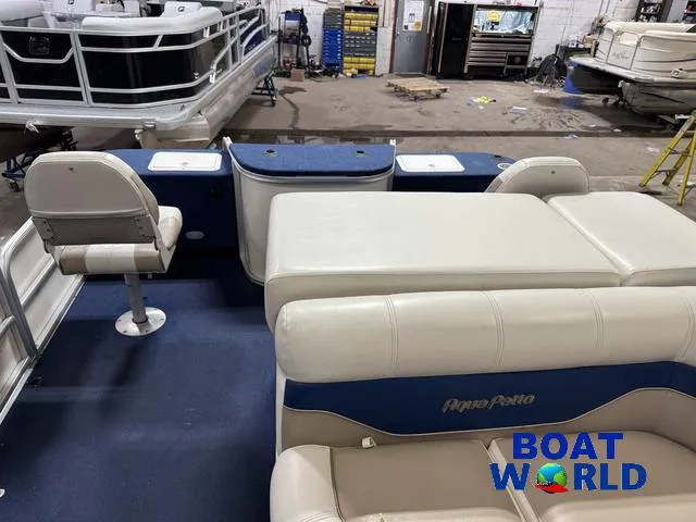 Slide: The Image of 2002 Godfrey 220 DF Pontoon interior with seating, blue carpet, and "Boat World" logo. - 6