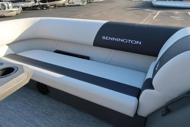 Slide: The Image of 2025 Bennington 22 SSB boat interior with comfortable seating and cup holder. - 11