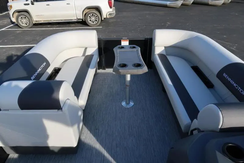 Slide: The Image of 2025 Bennington 22 SSB pontoon boat interior with seating and table. - 13