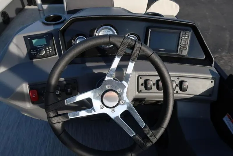 Slide: The Image of Steering wheel and dashboard of 2025 Bennington 22 SSB boat. - 17