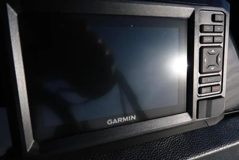 Slide: The Image of Garmin display on 2025 Bennington 22 SSB boat dashboard, reflecting sunlight. - 19