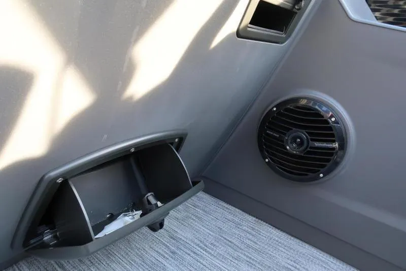Slide: The Image of Interior of 2025 Bennington 22 SSB boat with speaker and storage compartment. - 21