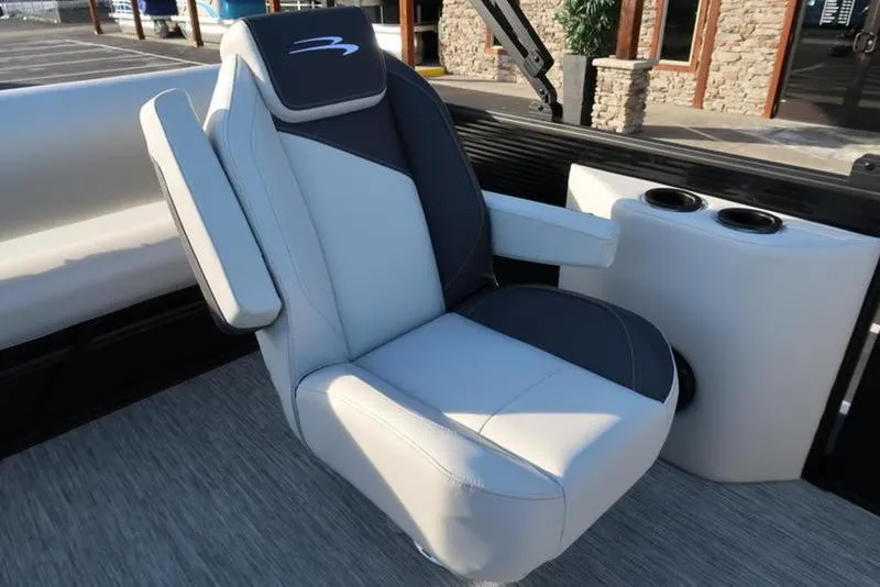 Slide: The Image of Captain's chair on 2025 Bennington 22 SSB boat, featuring sleek design and cup holders. - 23