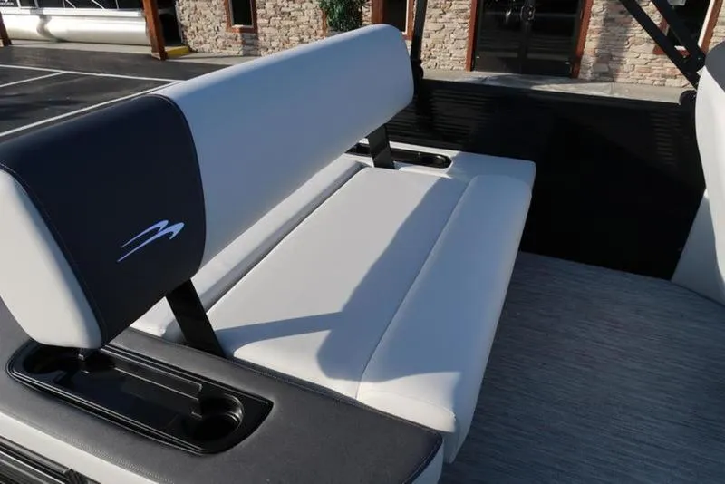 Slide: The Image of 2025 Bennington 22 SSB boat seat with sleek design and cup holders. - 25