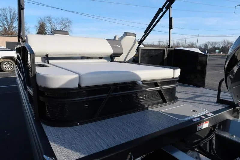 Slide: The Image of 2025 Bennington 22 SSB pontoon boat with sleek seating and modern design. - 5