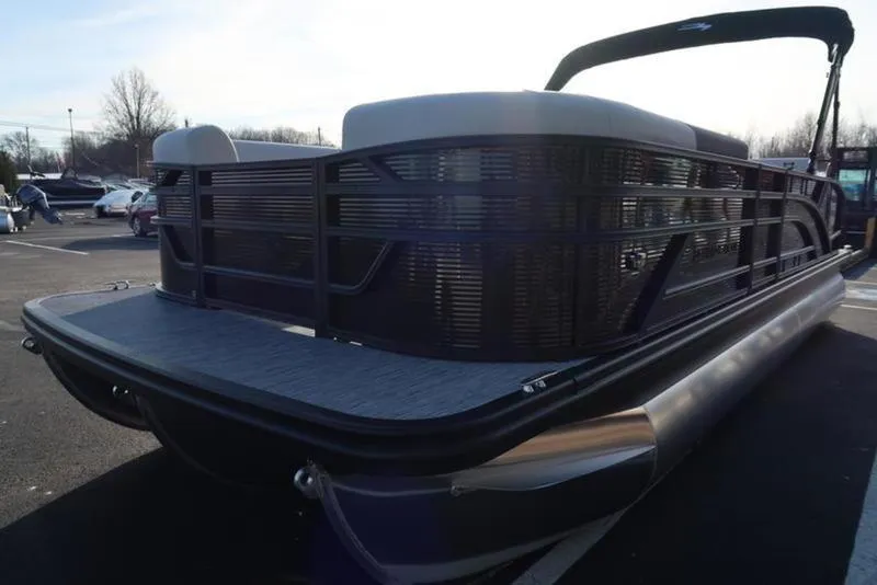 Slide: The Image of 2025 Bennington 22 SSB pontoon boat in a parking lot, rear view. - 7