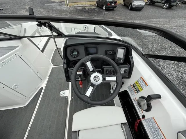 Slide: The Image of 2020 Yamaha Boats SX190 cockpit with steering wheel and control panel. - 8