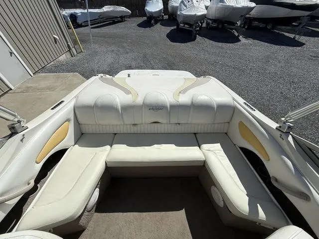 Slide: The Image of 2006 Stingray 195LR boat interior with white seating and outdoor storage area. - 5