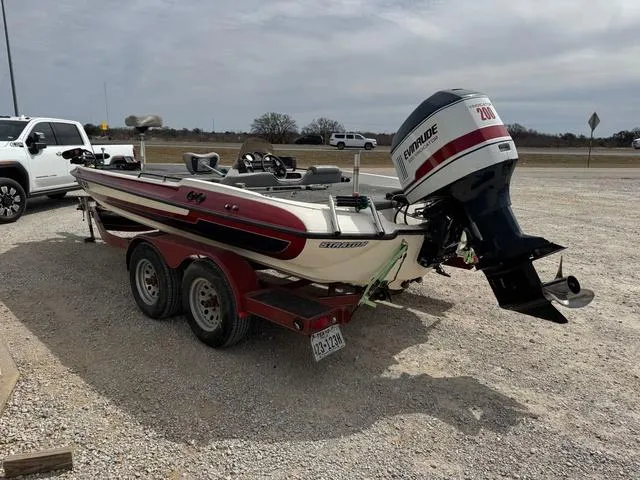 Slide: The Image of 1994 Stratos 201 PRO boat with Evinrude motor on a trailer in a gravel lot. - 4
