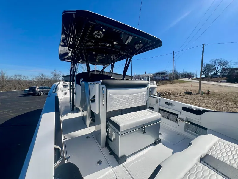 Slide: The Image of 2025 Nor-Tech 390 Sport Center Console boat with sleek seating and modern design. - 14