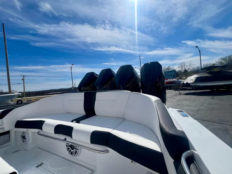 Slide: The Image of 2025 Nor-Tech 390 Sport Center Console boat with powerful engines and sleek design. - 18