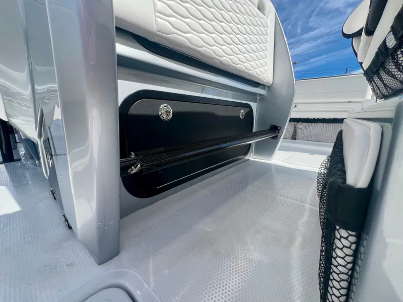 Slide: The Image of 2025 Nor-Tech 390 Sport Center Console interior with sleek seating and storage. - 23