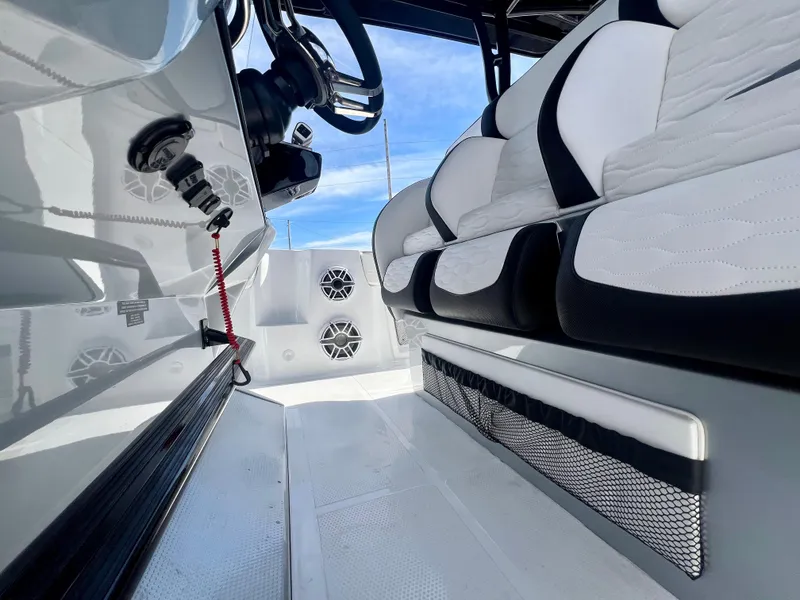Slide: The Image of 2025 Nor-Tech 390 Sport Center Console interior with sleek seating and modern design. - 30