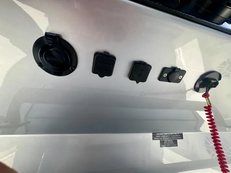 Slide: The Image of 2025 Nor-Tech 390 Sport Center Console dashboard with various control switches and safety cord. - 31