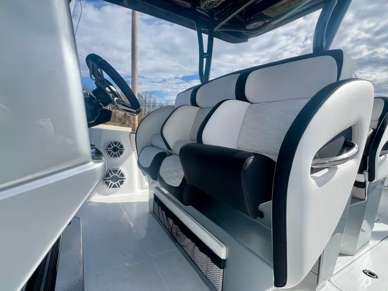 Slide: The Image of 2025 Nor-Tech 390 Sport Center Console interior with luxurious seating and modern design. - 37